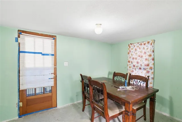 a kitchen with a refrigerator and a sink