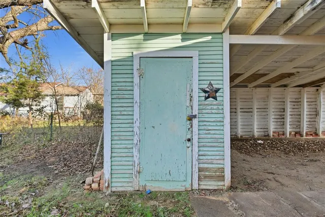 a view of a door and a window