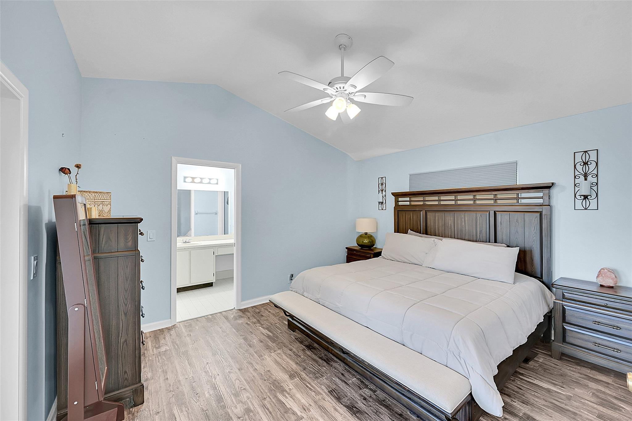 22533 Swordfish Drive Boca Raton, FL 33428 - Photo 17 of 49 a bedroom with a large bed and a chandelier