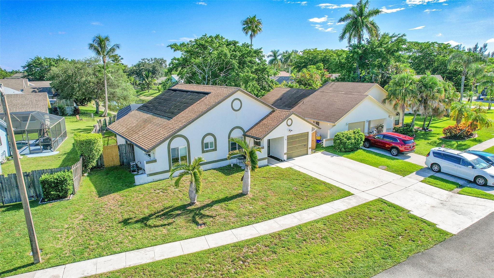 22533 Swordfish Drive Boca Raton, FL 33428 - Photo 2 of 49 a view of house with garden