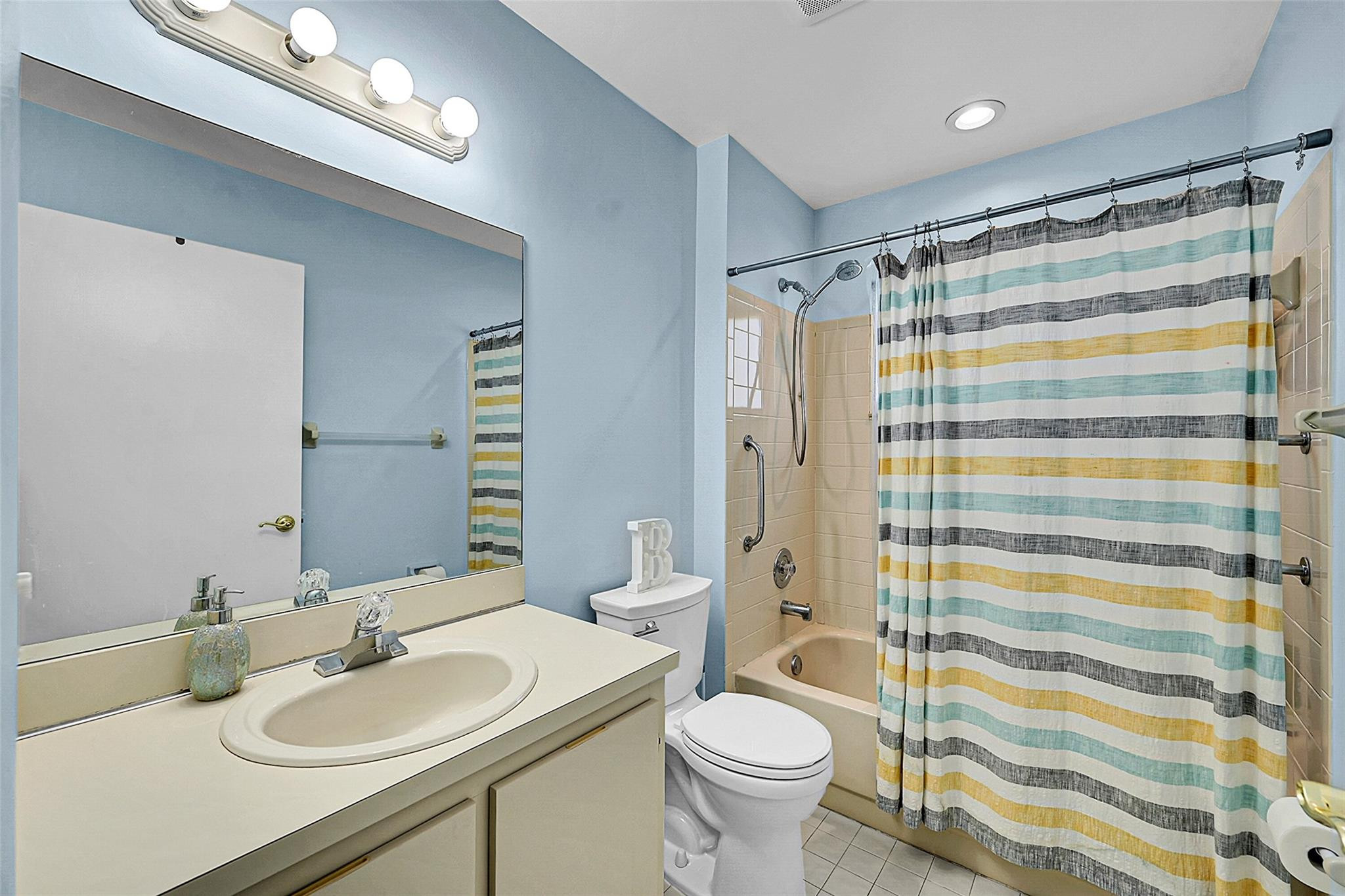 22533 Swordfish Drive Boca Raton, FL 33428 - Photo 25 of 49 a bathroom with a sink toilet and shower