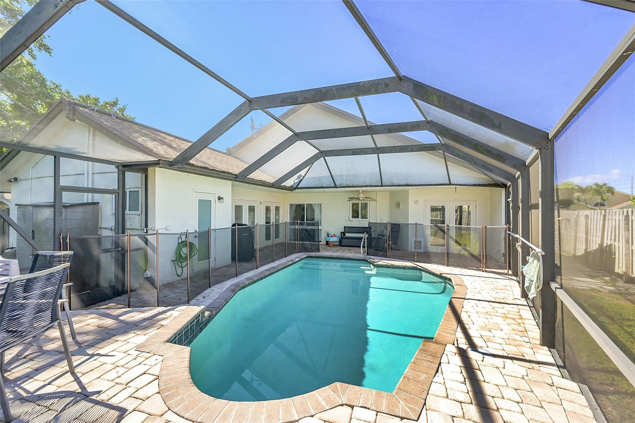 22533 Swordfish Drive Boca Raton, FL 33428 - Photo 28 of 49 a view of a swimming pool with a patio