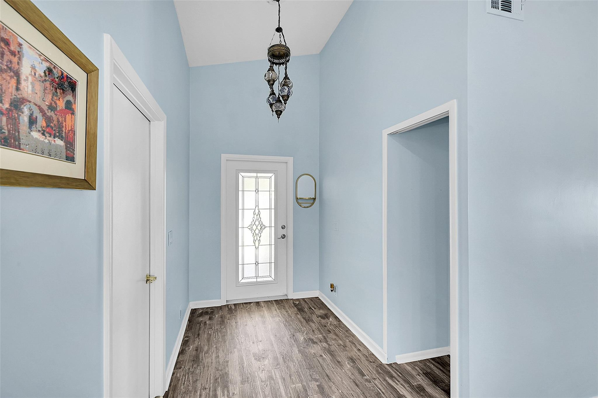 22533 Swordfish Drive Boca Raton, FL 33428 - Photo 4 of 49 a view of an entryway with wooden floor