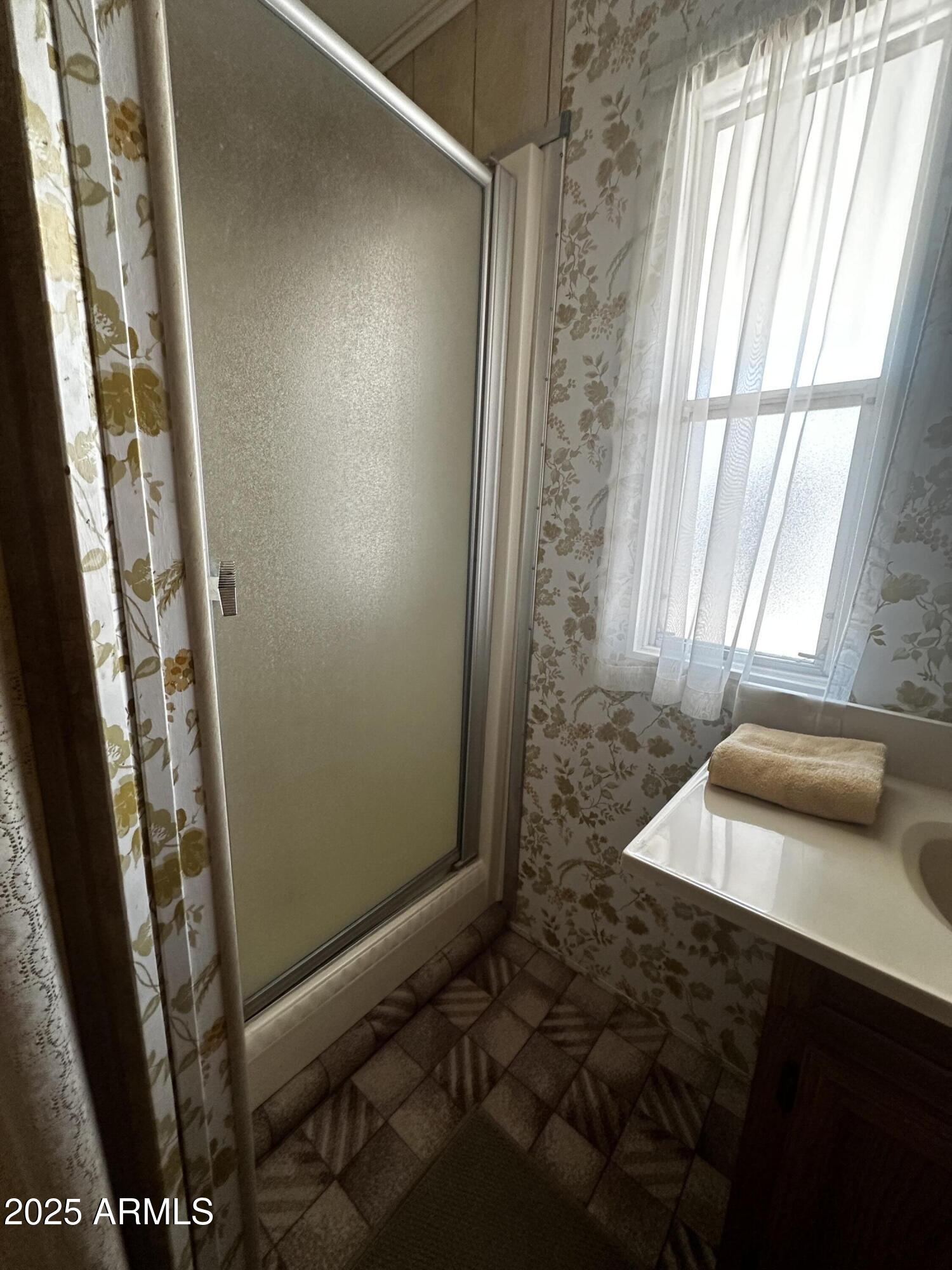 2605 South Tomahawk Road, Unit 8 Apache Junction, AZ 85119 - Photo 13 of 21 a bathroom with a tub and shower