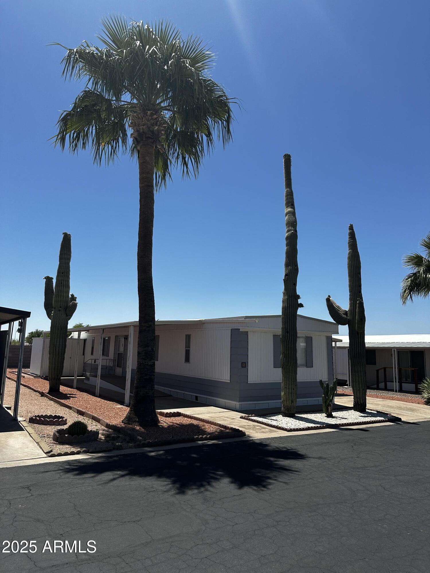 2605 South Tomahawk Road, Unit 8 Apache Junction, AZ 85119 - Photo 21 of 21 a front view of houses with street