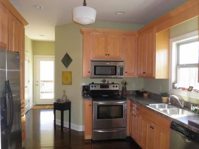 480 Knox Pearson Road Manchester, TN 37355 - Photo 7 of 20 Kitchen area has a half bath and utility area just off the back and then leads to a covered back porch with lots of privacy. Must see to fully appreciate.
