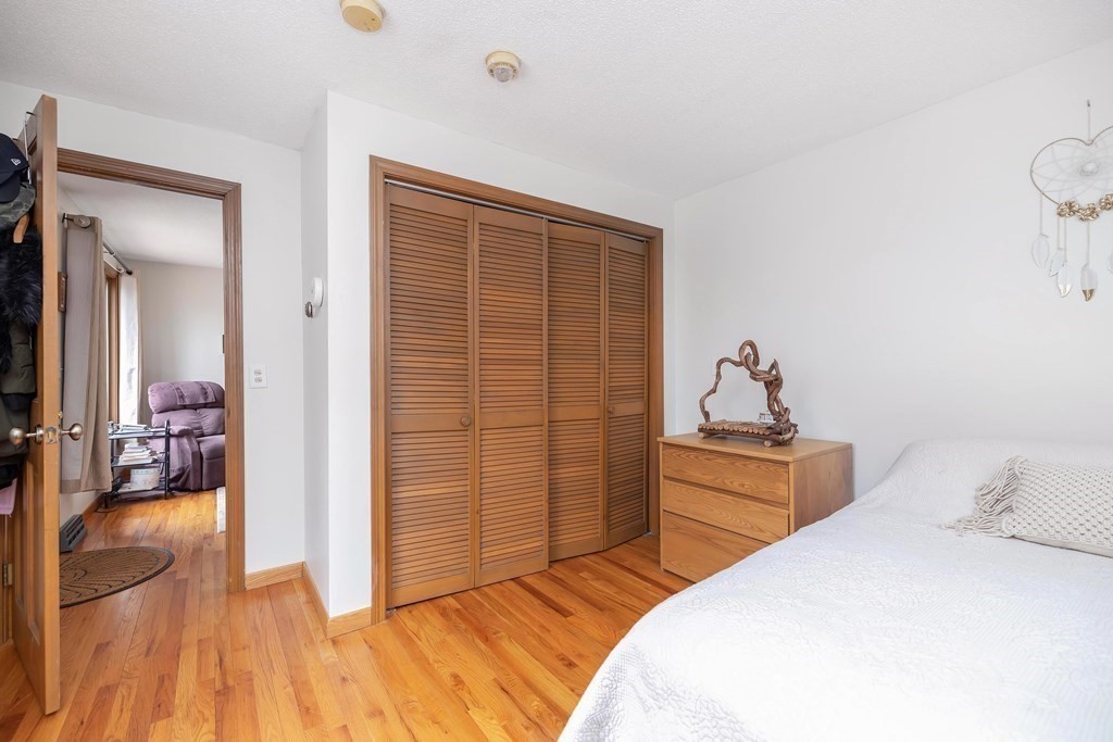 140 North Monson Road Hampden, MA 01036 - Photo 22 of 29 a bedroom with a bed and wooden floor