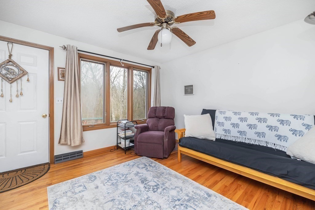 140 North Monson Road Hampden, MA 01036 - Photo 8 of 29 a living room with furniture and a large window