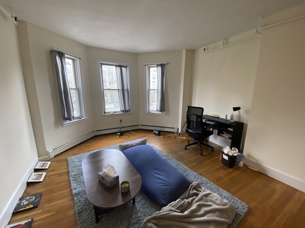 712 Commonwealth Avenue, Unit 2 Boston, MA 02215 - Photo 1 of 13 a room with furniture and wooden floor