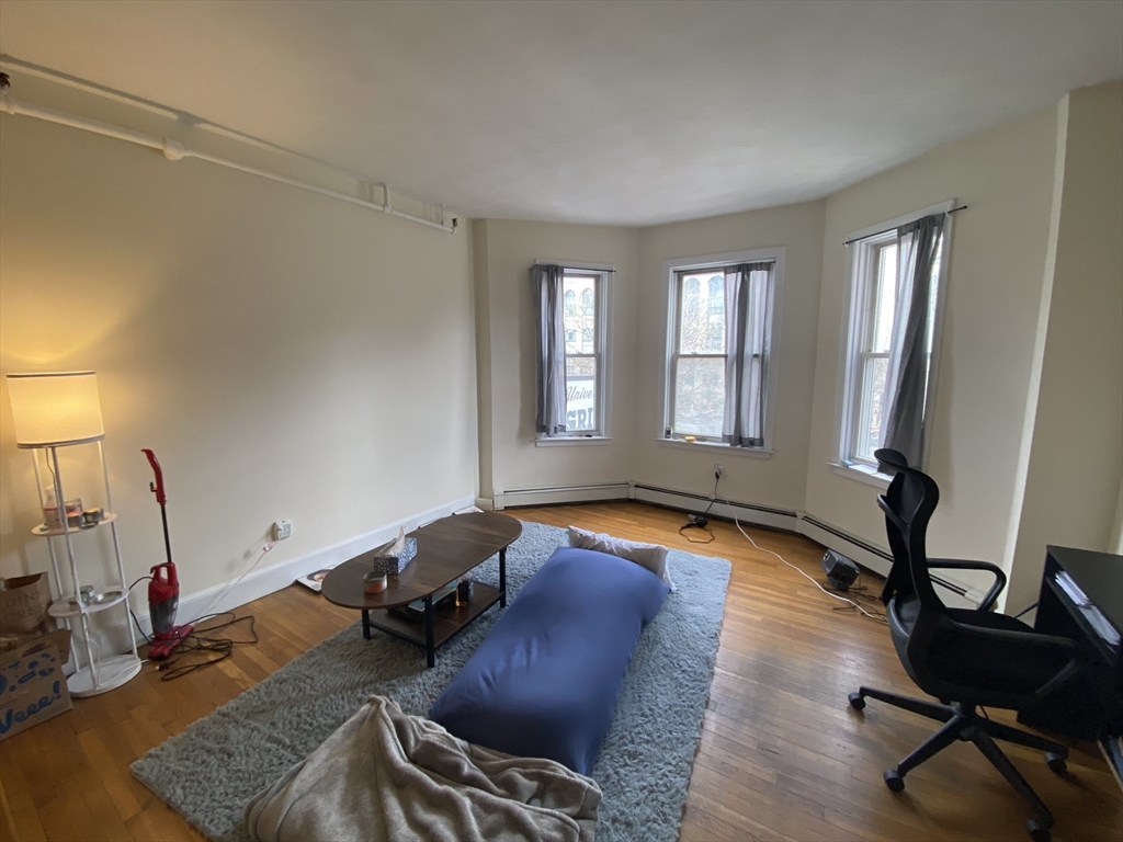 712 Commonwealth Avenue, Unit 2 Boston, MA 02215 - Photo 4 of 13 a living room with furniture and a window