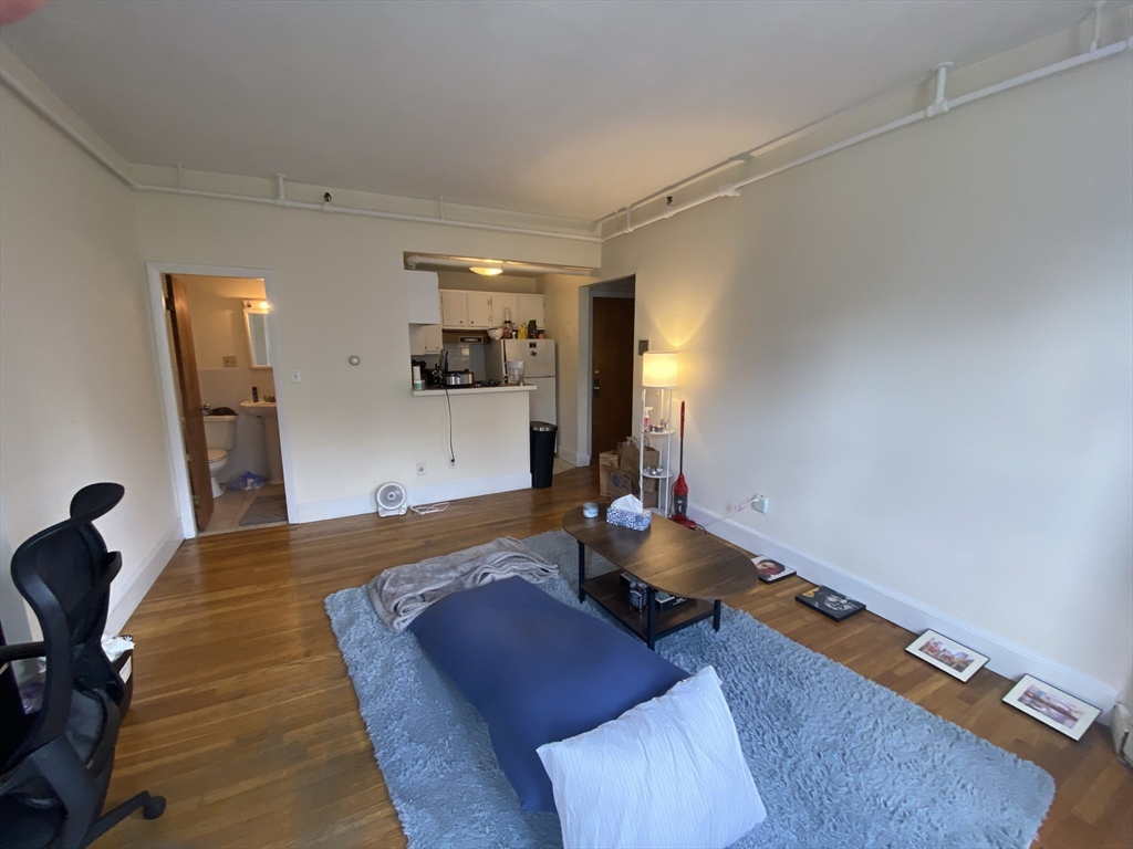 712 Commonwealth Avenue, Unit 2 Boston, MA 02215 - Photo 5 of 13 a living room with furniture and a flat screen tv