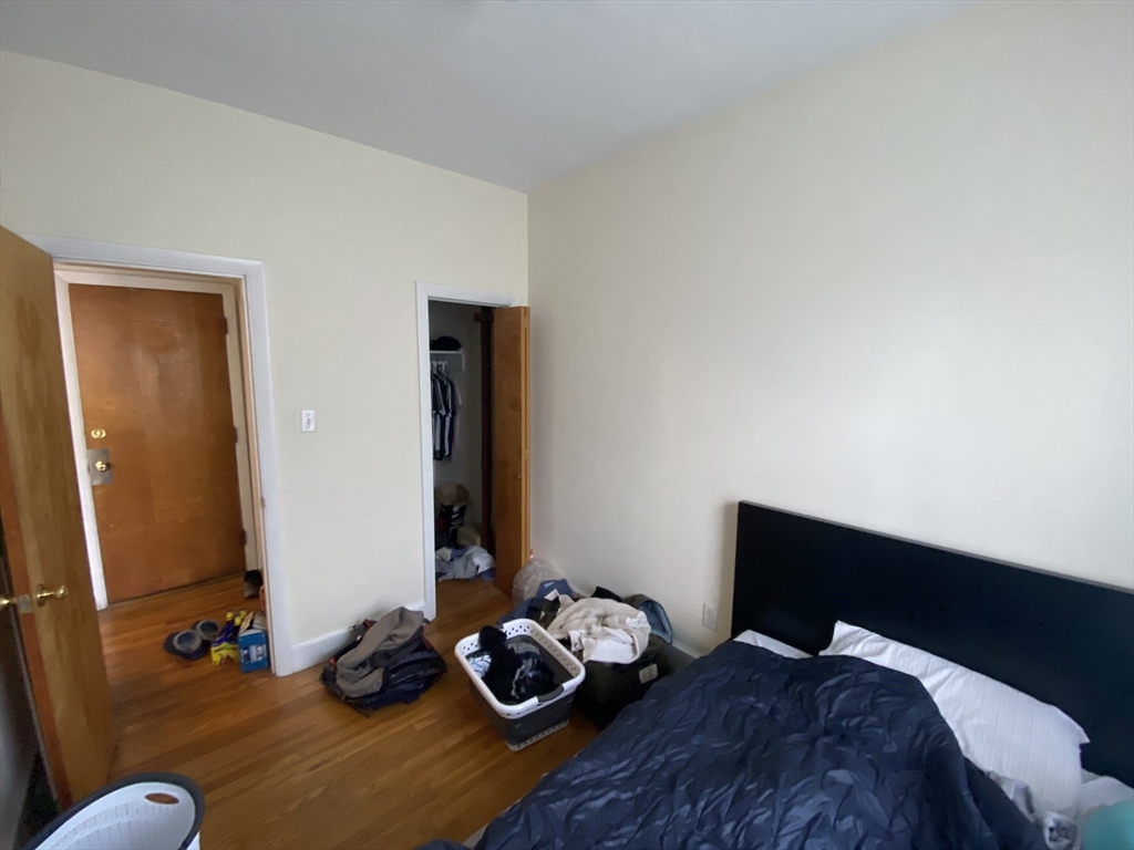 712 Commonwealth Avenue, Unit 2 Boston, MA 02215 - Photo 8 of 13 a bedroom with a bed and a window