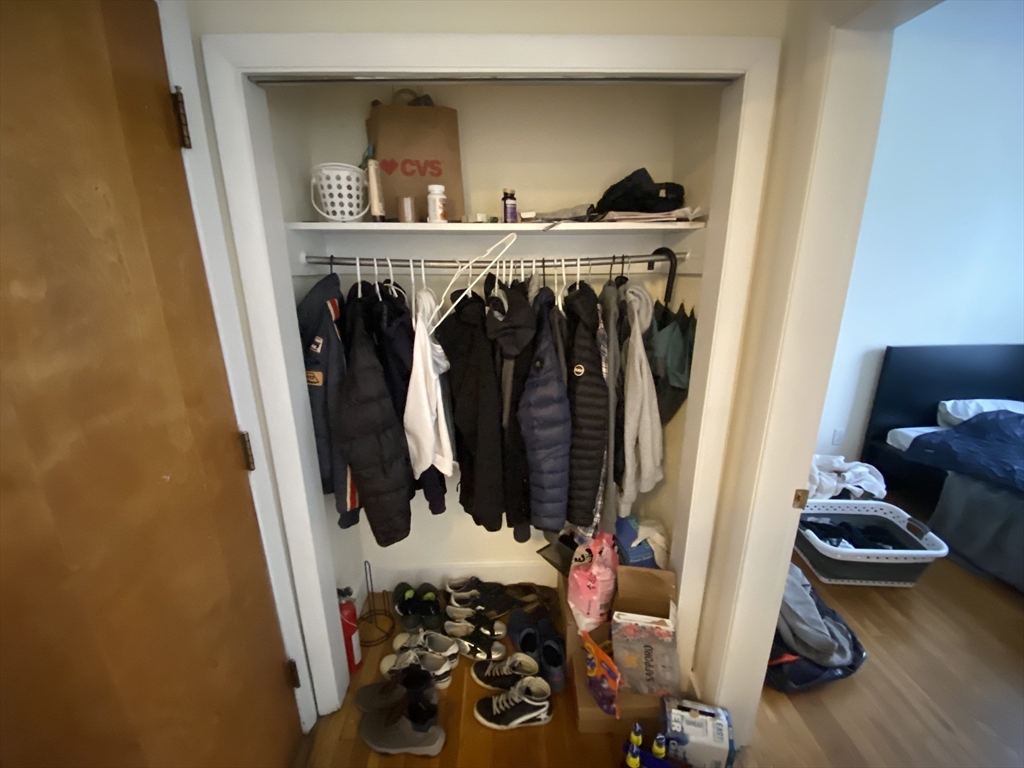 712 Commonwealth Avenue, Unit 2 Boston, MA 02215 - Photo 10 of 13 a view of walk in closet with clothes and shoes