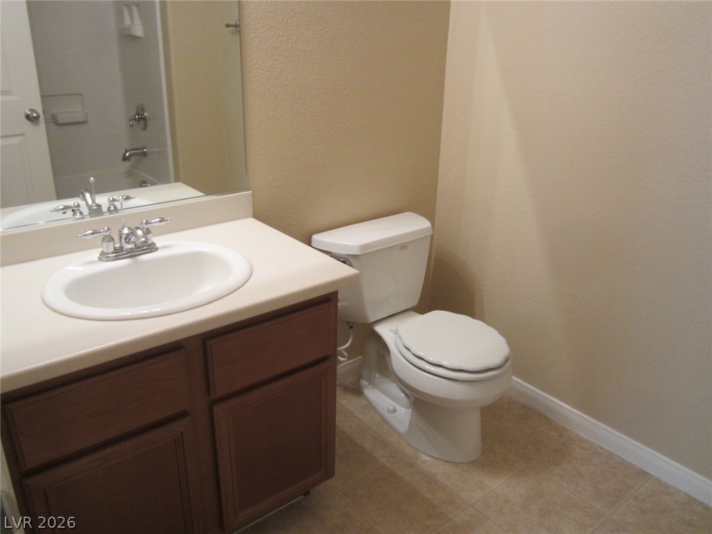 7701 West Robindale Road, Unit 262 Las Vegas, NV 89113 - Photo 13 of 26 Functional full bathroom featuring a vanity with integrated sink and easy-to-maintain tile flooring.