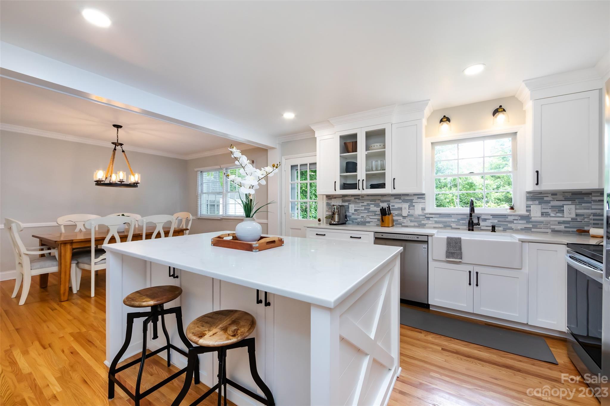 513 Sandridge Road Charlotte, NC 28210 - Photo 11 of 32 a kitchen with a table and chairs in it