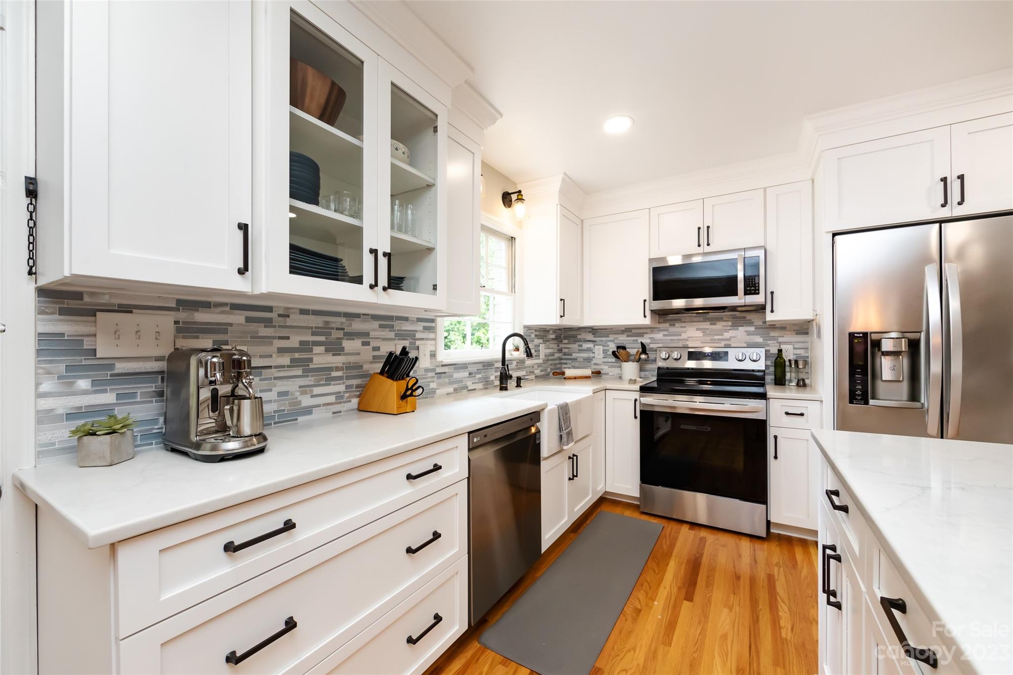 513 Sandridge Road Charlotte, NC 28210 - Photo 13 of 32 a kitchen with stainless steel appliances a stove microwave and a refrigerator