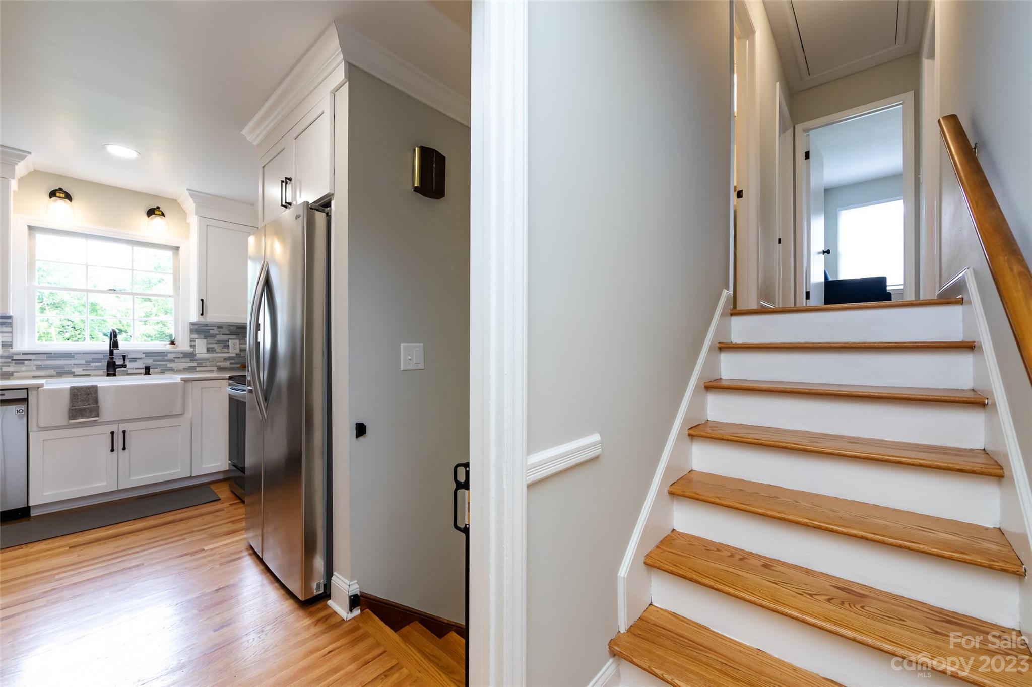 513 Sandridge Road Charlotte, NC 28210 - Photo 14 of 32 a view of entryway and kitchen with wooden floor