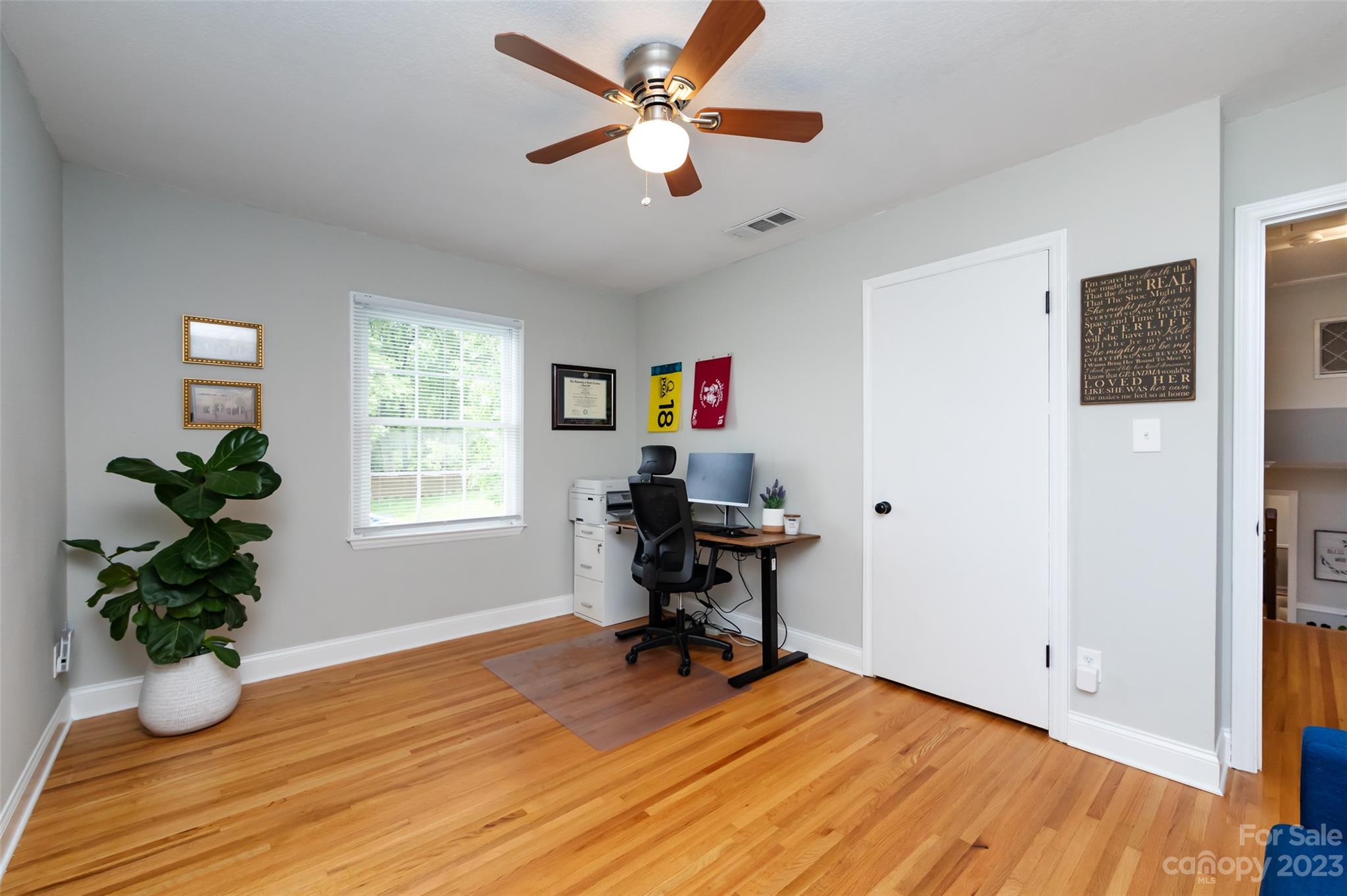 513 Sandridge Road Charlotte, NC 28210 - Photo 18 of 32 a workspace with furniture window and wooden floor