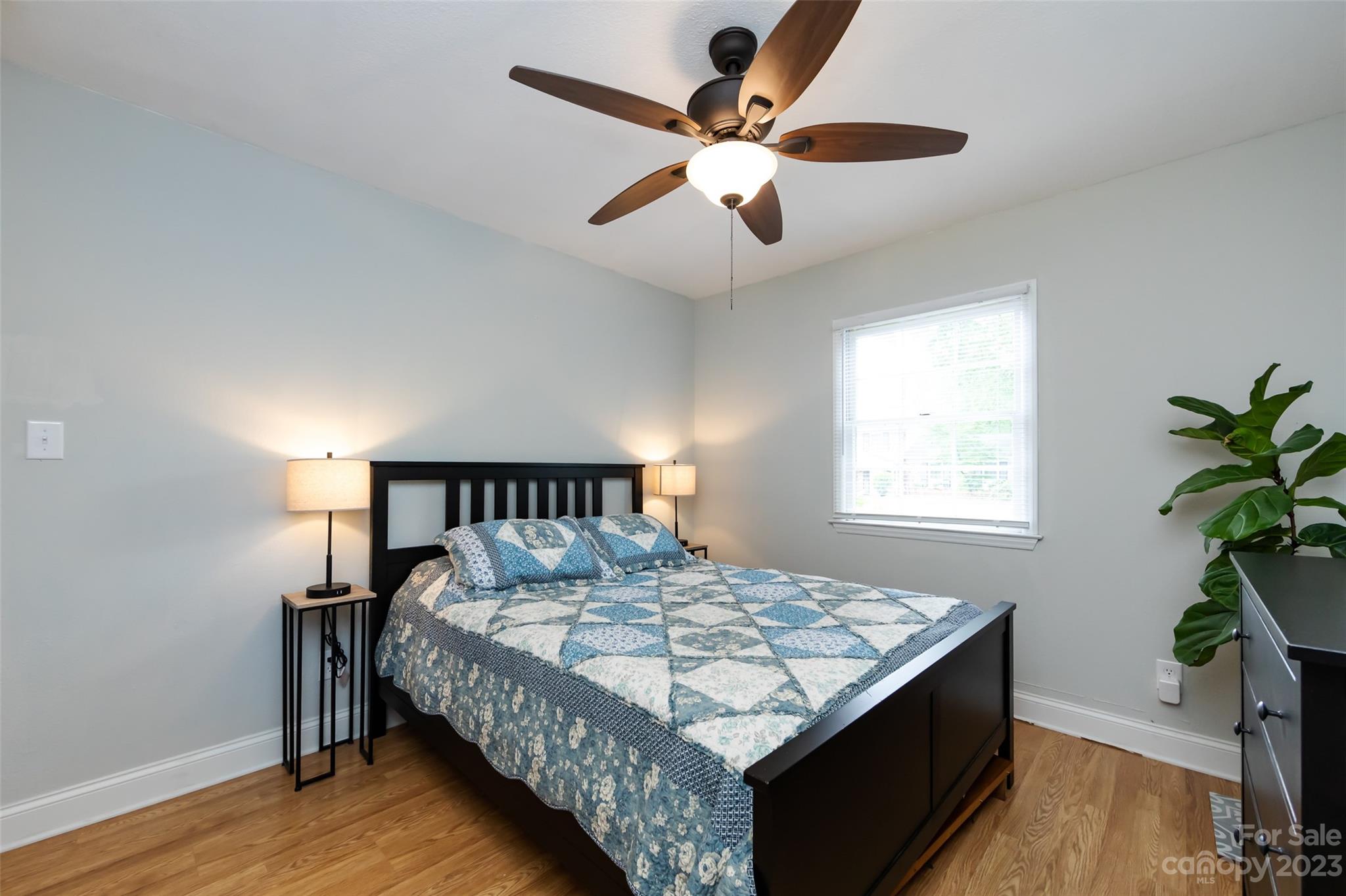 513 Sandridge Road Charlotte, NC 28210 - Photo 25 of 32 a bed sitting in a bedroom next to a window