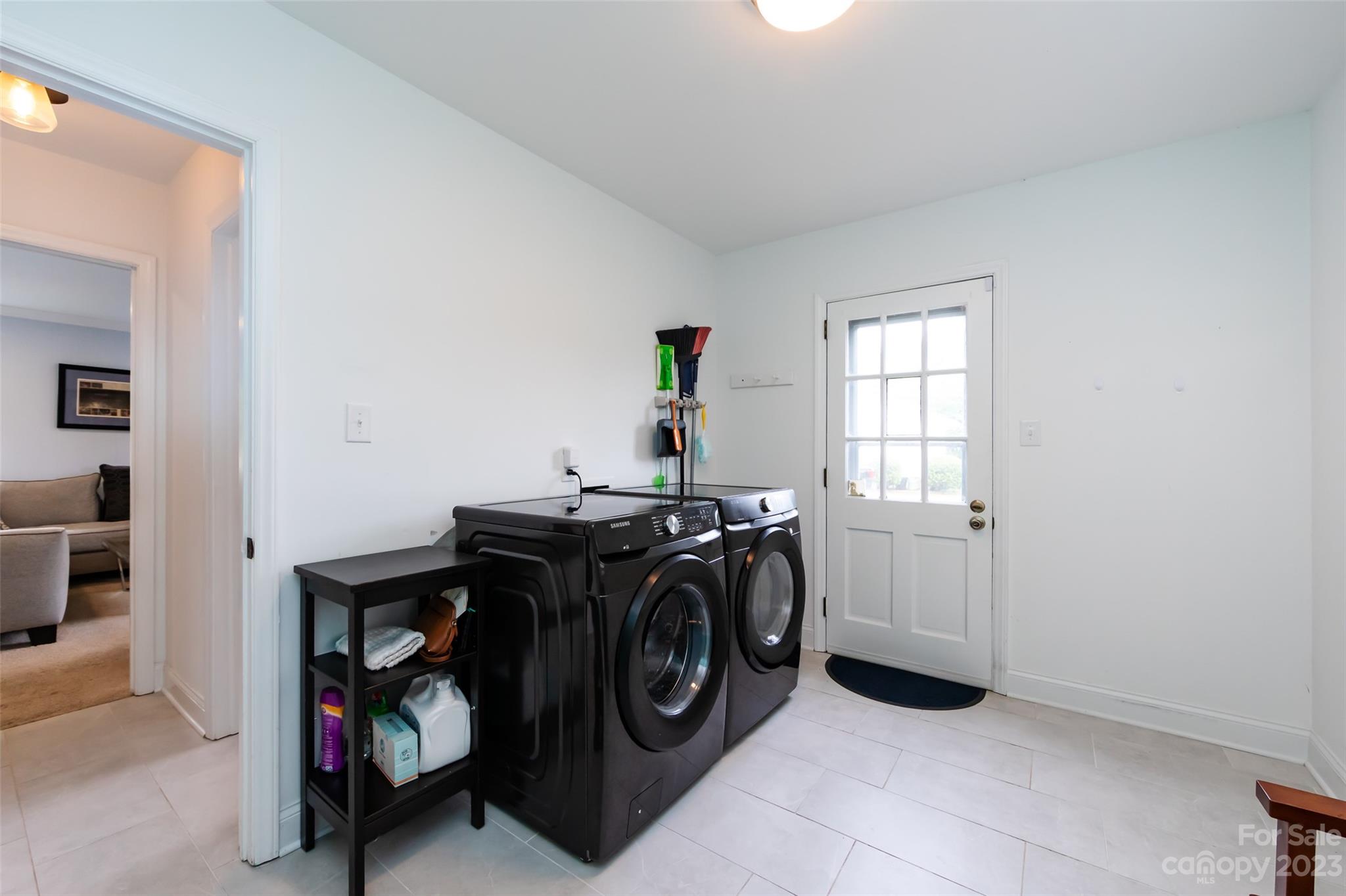 513 Sandridge Road Charlotte, NC 28210 - Photo 27 of 32 a utility room with dryer washer and a window