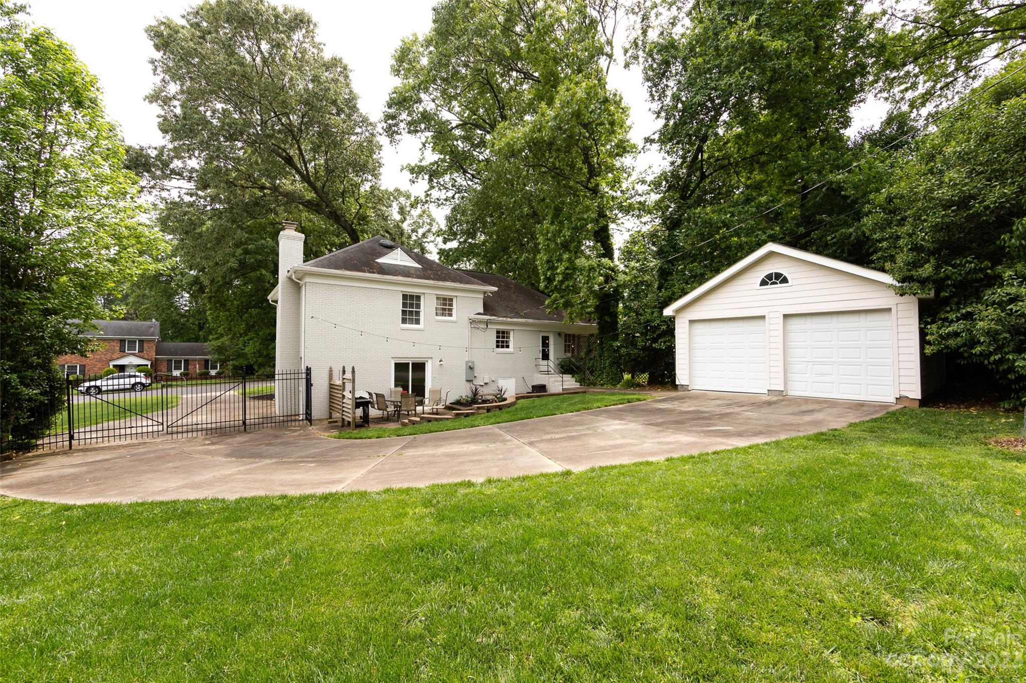 513 Sandridge Road Charlotte, NC 28210 - Photo 29 of 32 a view of a house with a yard and garage