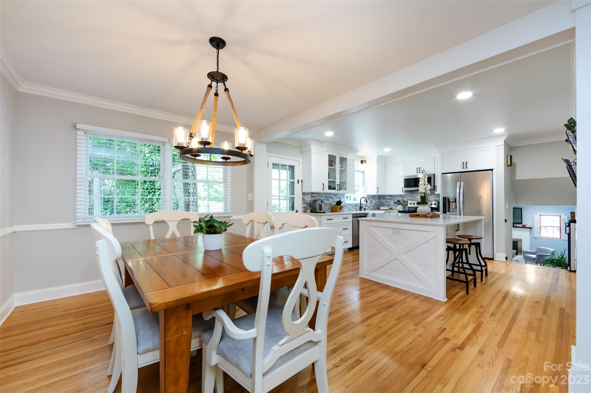 513 Sandridge Road Charlotte, NC 28210 - Photo 10 of 32 a view of a dining room with furniture window and wooden floor