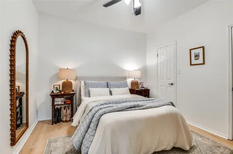 a bedroom with a bed and a lamp
