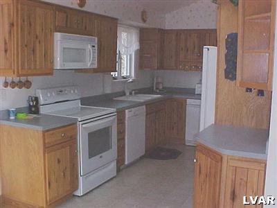 10 H.T.Y. Road Kunkletown, PA 18058 - Photo 5 of 7 a kitchen with a sink stove and cabinets