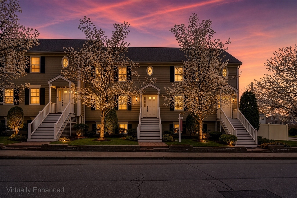 a view of house with a tree in front