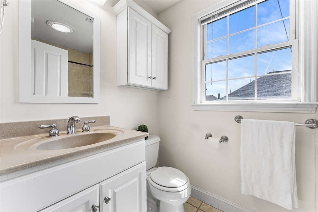 30 Russell Street, Unit 5 Waltham, MA 02453 - Photo 19 of 26 a bathroom with a sink and a toilet