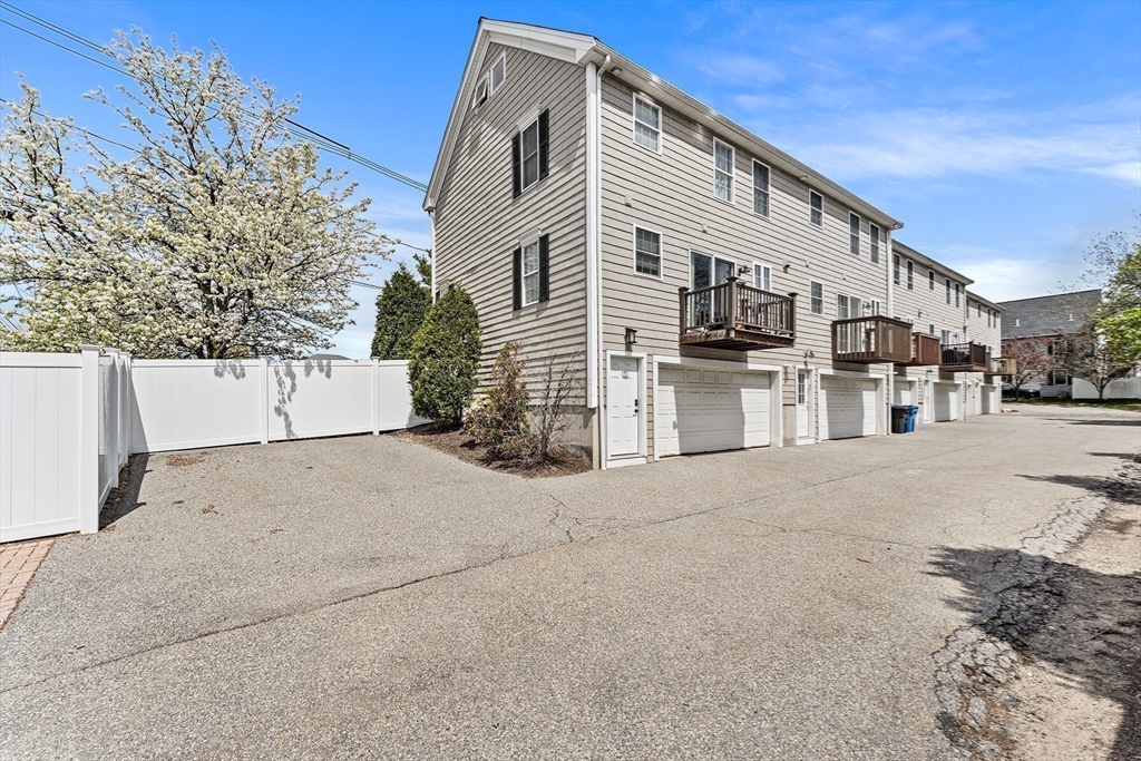 30 Russell Street, Unit 5 Waltham, MA 02453 - Photo 25 of 26 a view of a street with a building