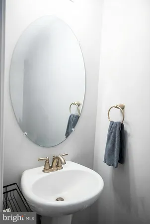 a bathroom with a sink and mirror