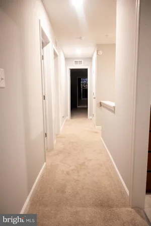 a view of a hallway with an entryway