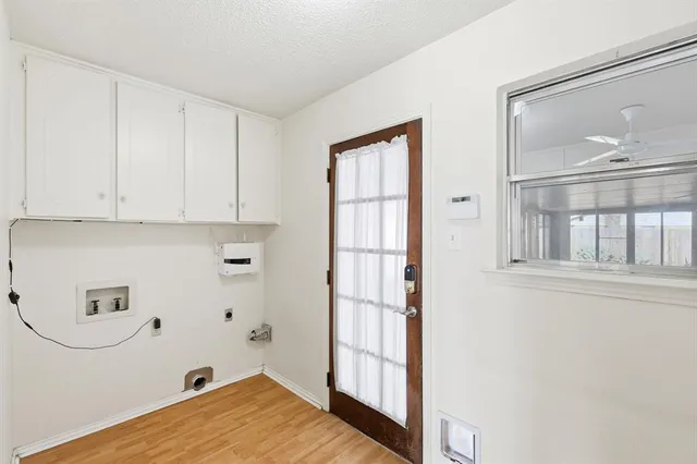 a view of kitchen with furniture and wooden floor