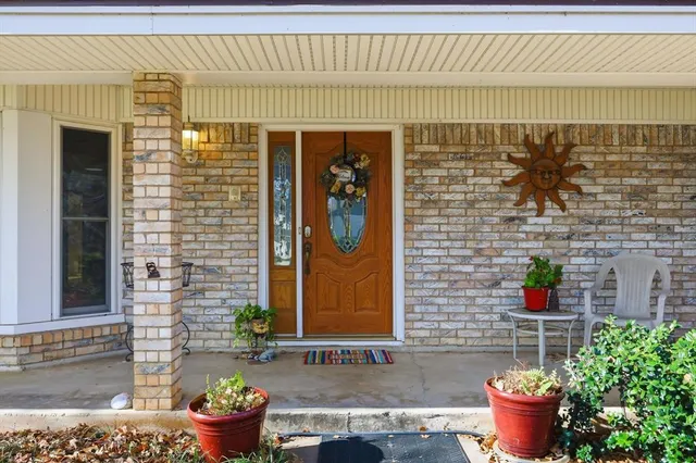 a front view of a house with outdoor seating