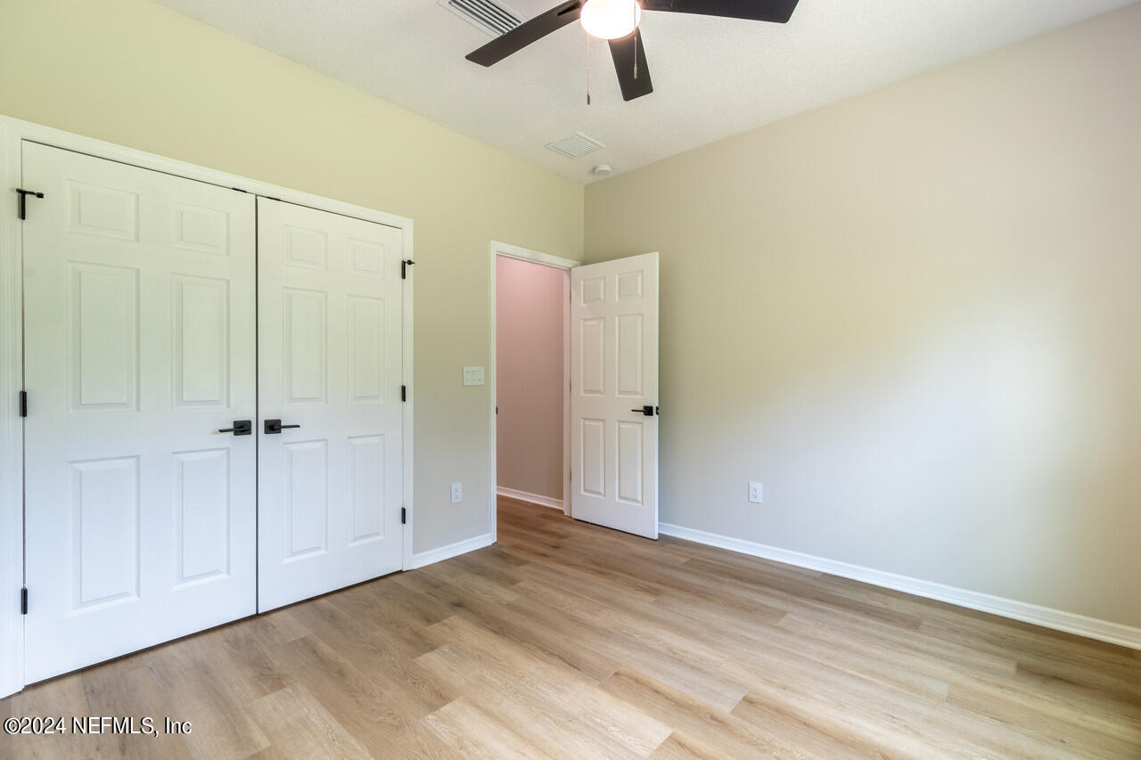 23 River Road Orange Park, FL 32073 - Photo 32 of 39 REAR G.BR CLOSET DOORS