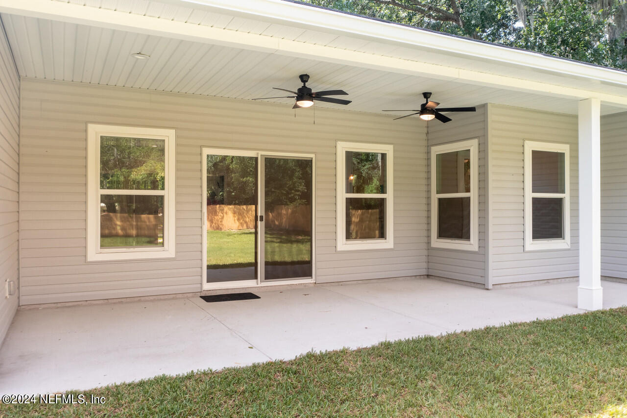 23 River Road Orange Park, FL 32073 - Photo 7 of 39 REAR PORCH TOWARDS SLIDER