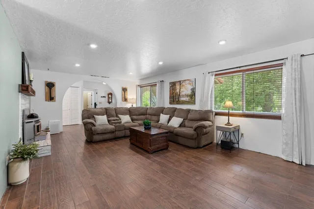 a living room with furniture and a large window