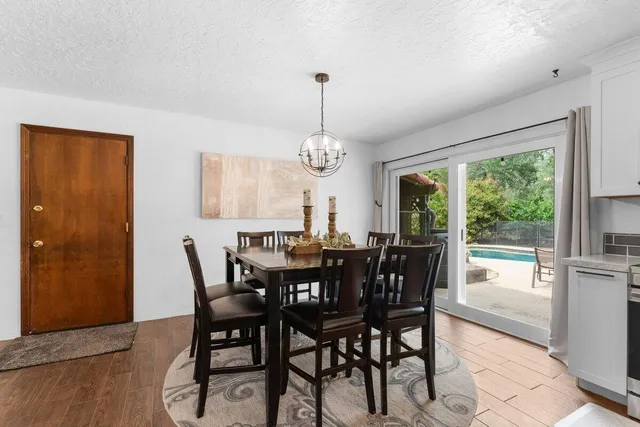 a view of a dining room with furniture window and outside view