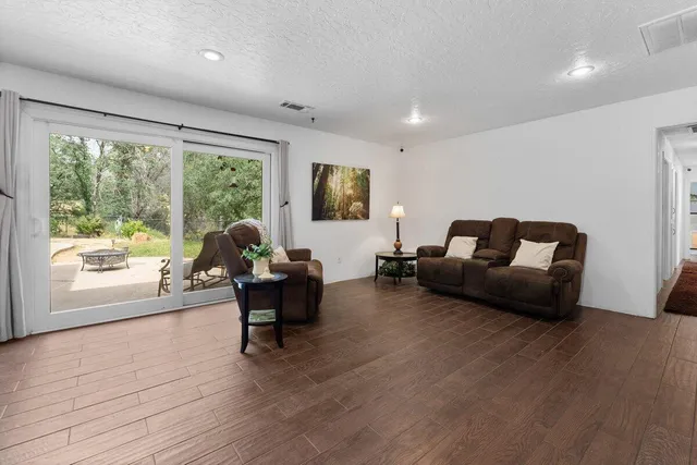 a spacious bedroom with a bed and furniture