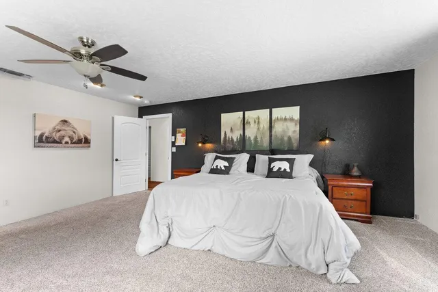 a en suite bathroom with a double vanity sink and a mirror