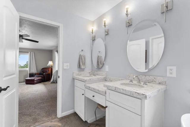 a bathroom with a tub and a window