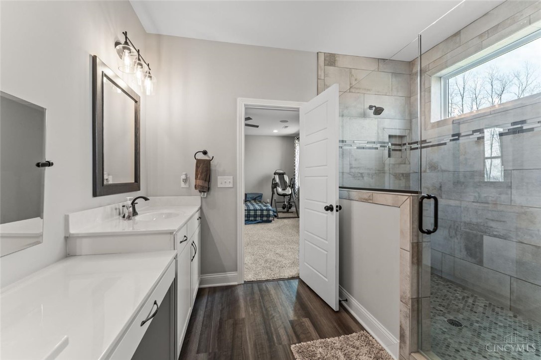 2425 Middleboro Road Clarksville, OH 45113 - Photo 68 of 91 This bathroom features a contemporary design with practical fixtures and a glass-enclosed shower.