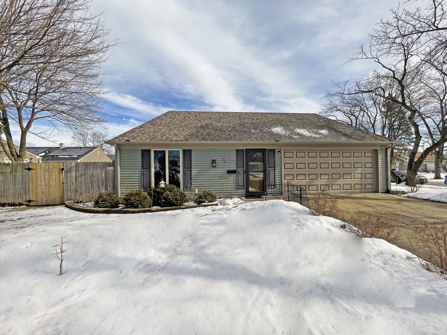 35 Winrock Road Montgomery, IL 60538 - Photo 1 of 37 a front view of a house with a yard and garage