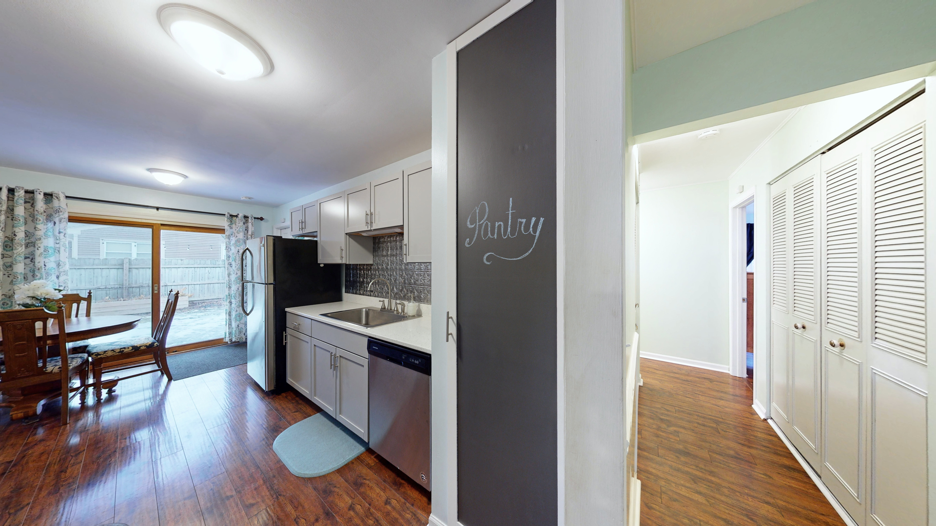 35 Winrock Road Montgomery, IL 60538 - Photo 11 of 37 a kitchen with a refrigerator and wooden floor
