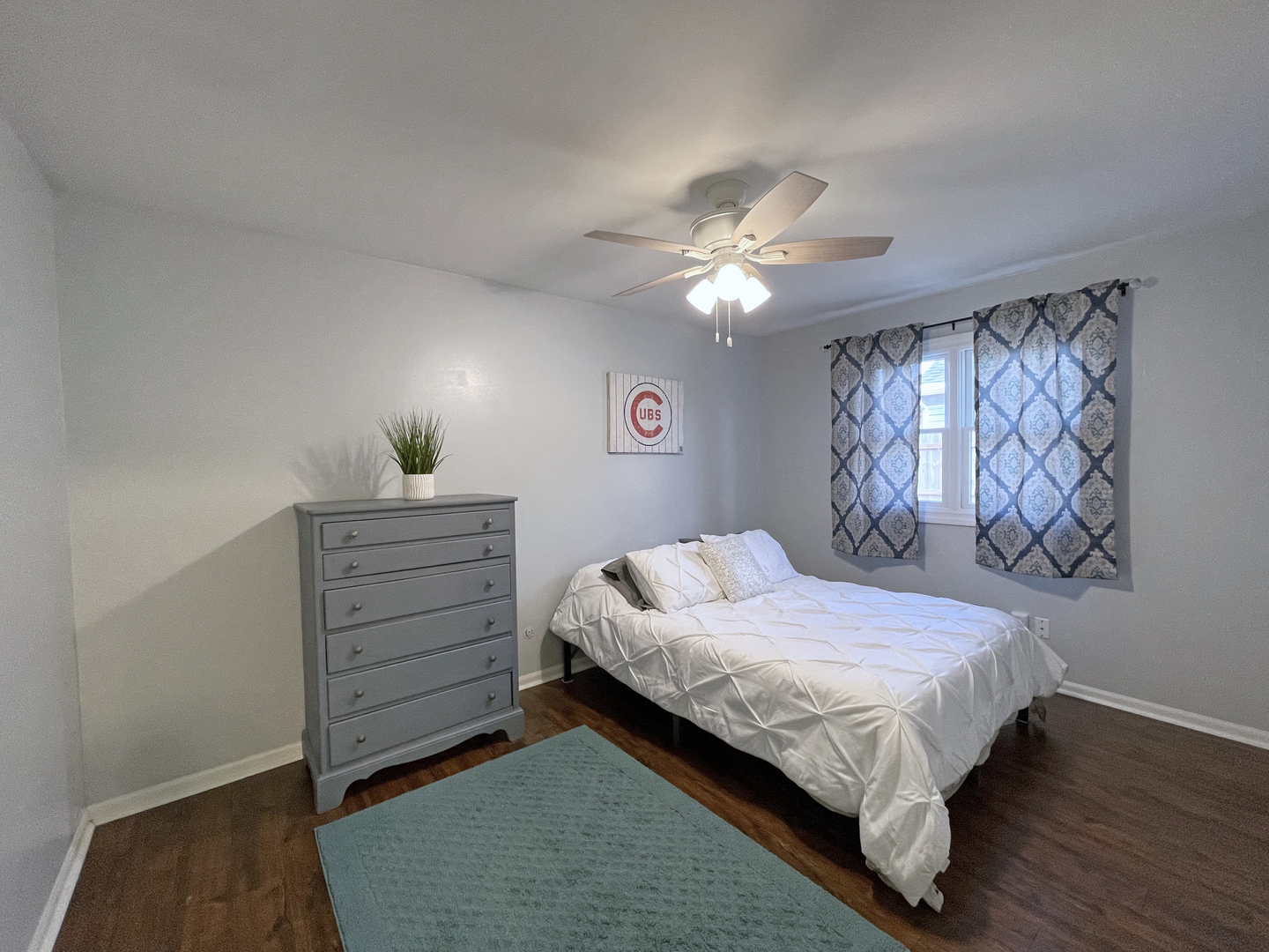 35 Winrock Road Montgomery, IL 60538 - Photo 16 of 37 a bedroom with a bed chandelier and a window