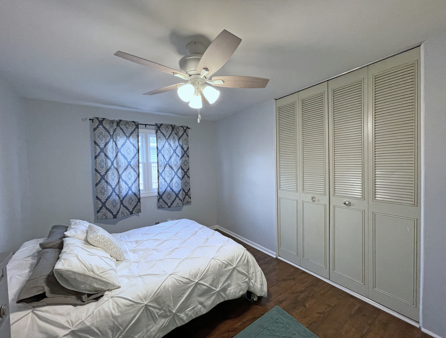 35 Winrock Road Montgomery, IL 60538 - Photo 17 of 37 a bedroom with a bed and a chandelier