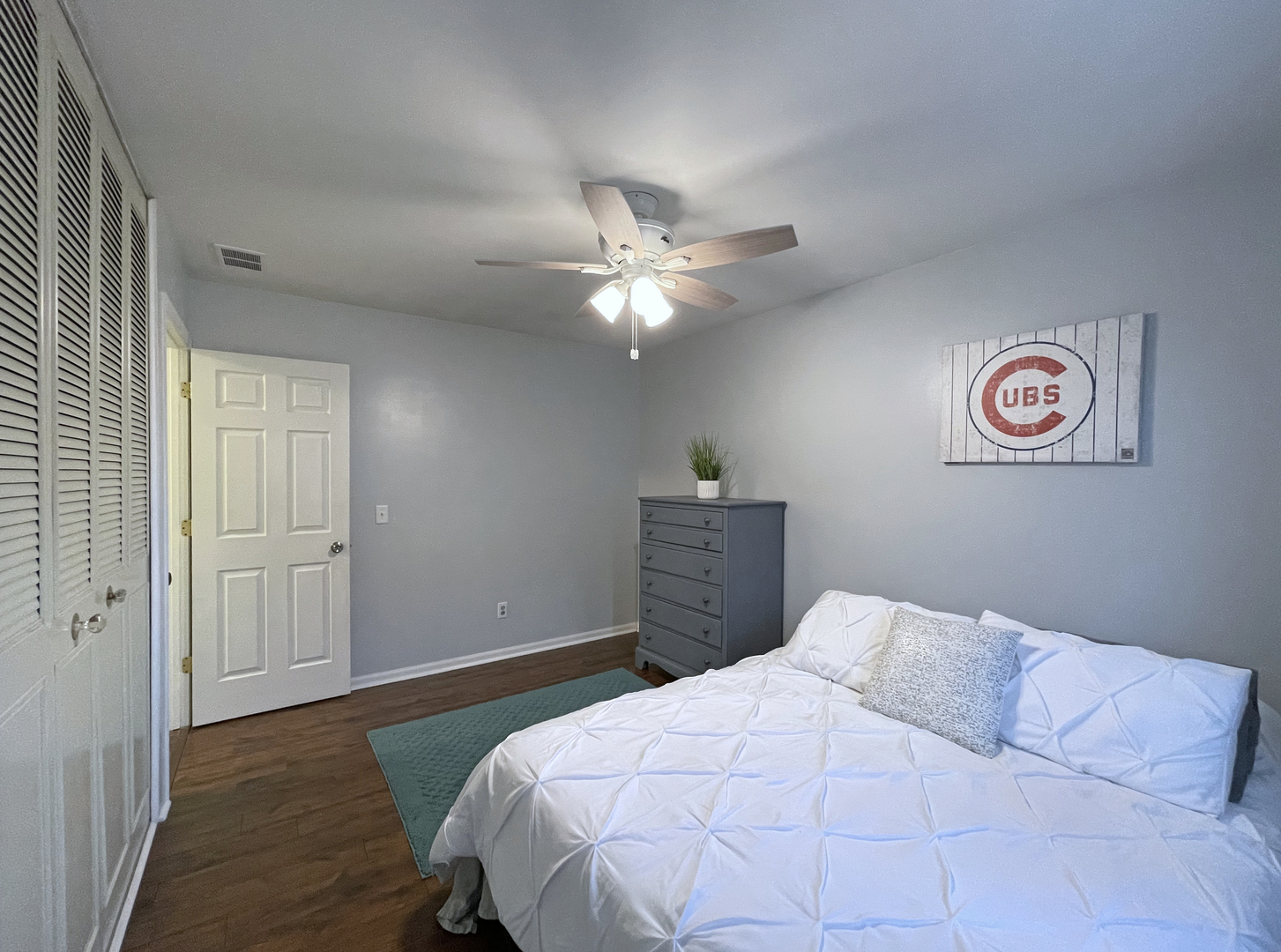 35 Winrock Road Montgomery, IL 60538 - Photo 18 of 37 a bedroom with a bed and a chandelier