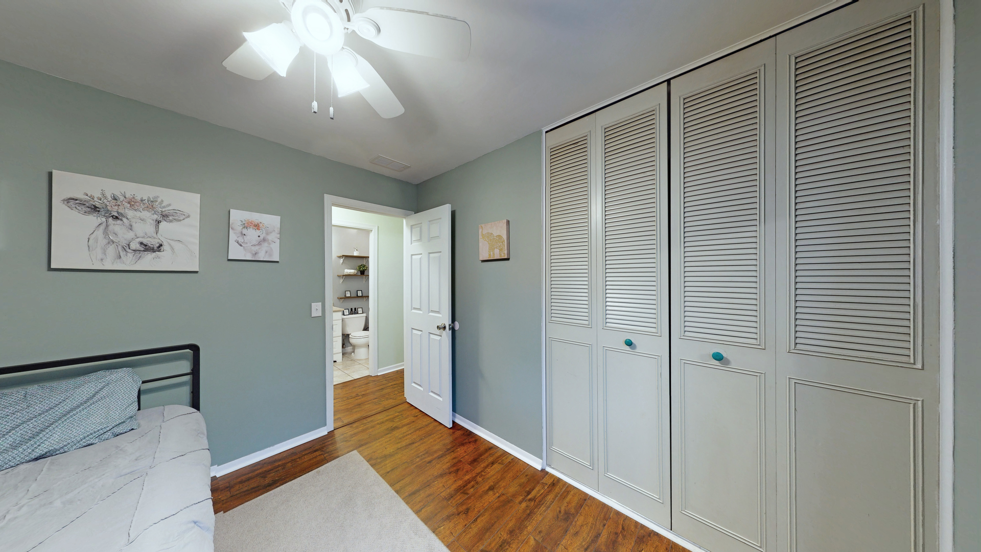35 Winrock Road Montgomery, IL 60538 - Photo 21 of 37 a view of a bedroom with wooden floor and a ceiling fan