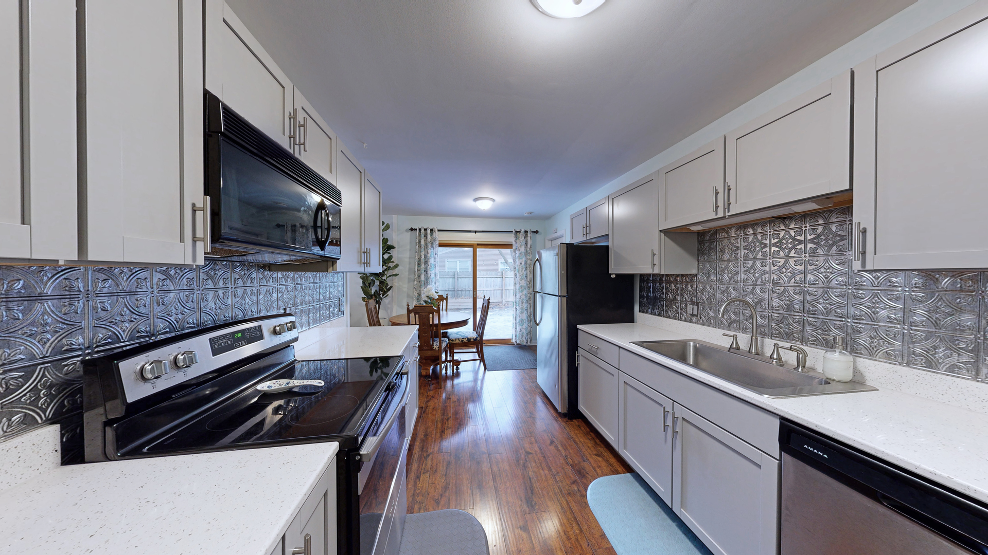 35 Winrock Road Montgomery, IL 60538 - Photo 7 of 37 a kitchen with a sink stainless steel appliances and cabinets